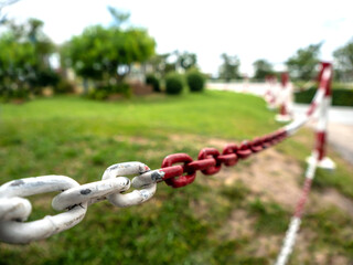 The fence is a large white and red chain