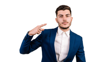 White businessman with brown hair isolated on a white background pointing a finger at his head