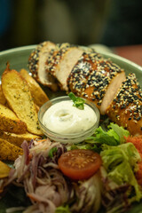 Healthy food bowl with chicken , potatoes and vegetables.