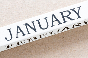 January text written on a white wooden cube. The beginning of the year, the first month is the time to prepare for the whole year.