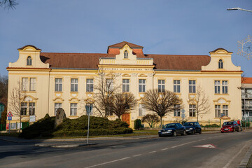 Yellow neo-renaissance house in sunny day, Secondary vocational school in historic center of medieval city Slany, Central Bohemia, Czech Republic