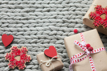 Gift boxes with ribbons on a handmade knitted cozy background. 
Valentine's Day presents. Happy Birthday. Love consept.