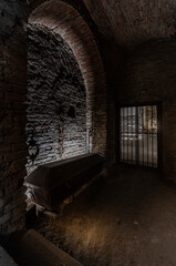 Catacombs of an ancient castle, chateau with coffin