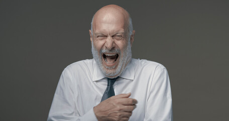 Cheerful businessman laughing out loud