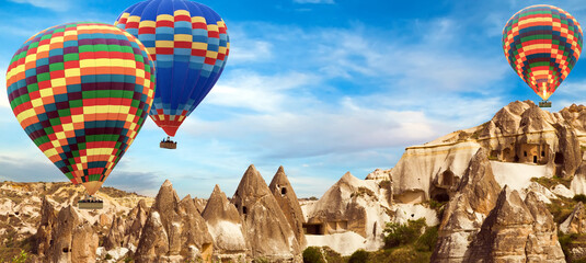 Hot Air balloons flying tour over Cappadocia landscape valley in Goreme village. © Emoji Smileys People