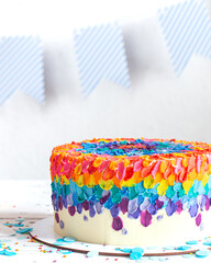 Fototapeta na wymiar Colorful big handmade birthday cake on the holiday table