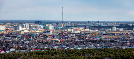 Panoramic view of Yakutsk skyline with TV tower and center of the city in the evening - 401954324