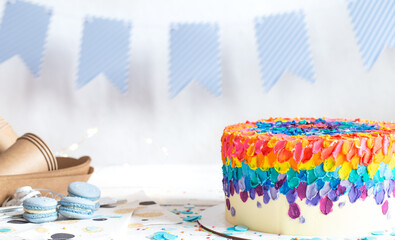 Colorful big handmade birthday cake on the holiday table