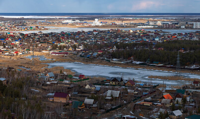 Aerial view of Yakutsk skyline with a small lake - 401954367