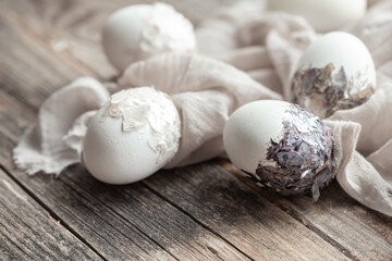 Original decorated Easter eggs close up on sacking cloth.
