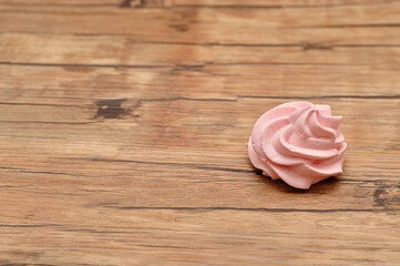 A pink meringue on a table
