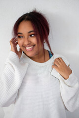 Young woman listening to the music on the mobile phone