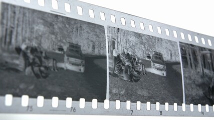 Watching Retro Pictures on Negative Plastic Film Strip