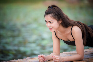 Asian woman is warm up, To make the muscles flexible Before going to jogging for good health and energy metabolism,Outdoors cross training workout. Healthcare concept