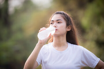 Asian woman is warm up, To make the muscles flexible Before going to jogging for good health and energy metabolism,Outdoors cross training workout. Healthcare concept