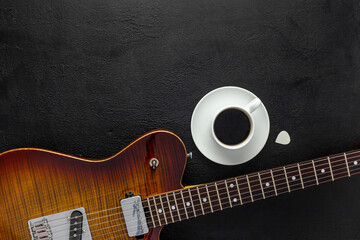 Desk of musician for songwriter work set with headphones and guitar