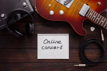Naklejka premium Beautiful electric guitar on with headphones and coffee desktop