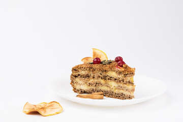A piece of gluten-free, egg-and milk-free nut cake with creamy Apple filling on a white plate, on a white background.