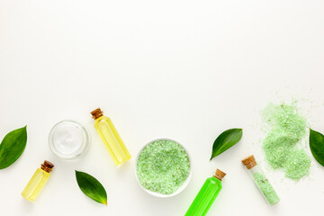 Fototapeta na wymiar Organic cosmetic set with tea olive leaves and sea salt