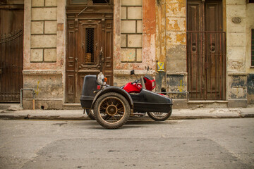 Old Motorbike with sidecar parked in the center of haVA, cUBA
