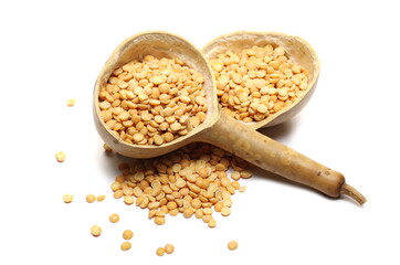 Yellow split peas pile with calabash gourd half isolated on white background