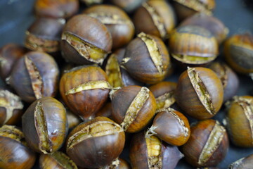 Roasted chestnuts are ready for sale hot.