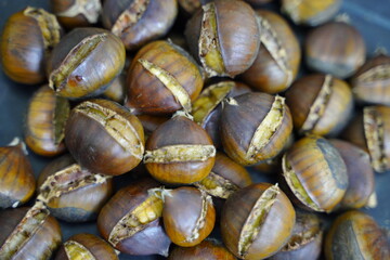 Roasted chestnuts are ready for sale hot.