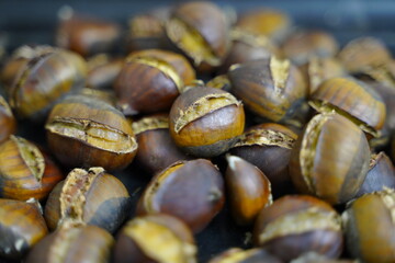 Roasted chestnuts are ready for sale hot.