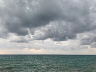 Fototapeta na wymiar Dark clouds on the sea