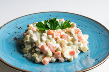 Russian traditional salad. Salad made of boiled vegetables and mayonnaise.