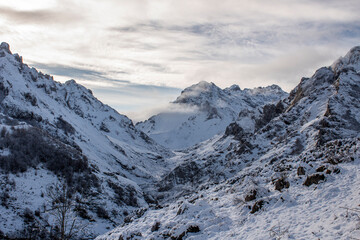 Fototapeta premium Snowy mountain in a cloudy day, Picos de Europa