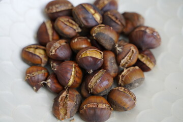 Roasted chestnuts are ready for sale hot.