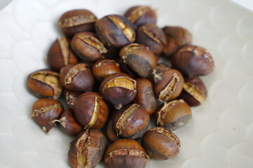 Roasted chestnuts are ready for sale hot.