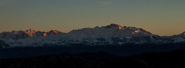Big snowy mountain in the sunset, panoramic