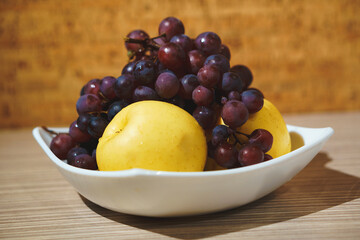 red grape and apples on plate
