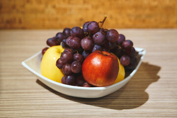 Naklejka na ściany i meble plate with fruits on table