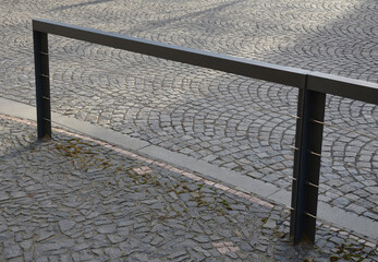 mosaic of small marble cubes. sidewalks and squares formed by stone carpet with squares, polka dots...