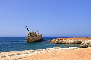 Shipwreck of the abandoned ship Edro III on a rocky coast at Akrotiri Beach in Cyprus