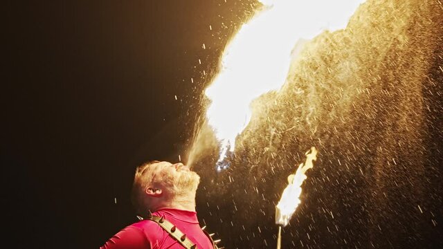 Man breathes fire during his solo show in Europe