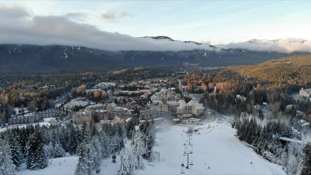 Aerial hyperlapse of Whistler Village and ski runs at sunset. 4K 24FPS.