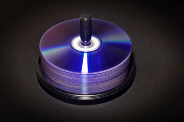 DVD discs in an open box on a black background