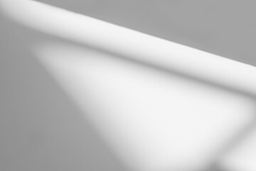 Abstract shadow and striped diagonal light background on white wall  from window,  architecture dark gray and sunshine diagonal geometric effect overlay for backdrop and mockup design