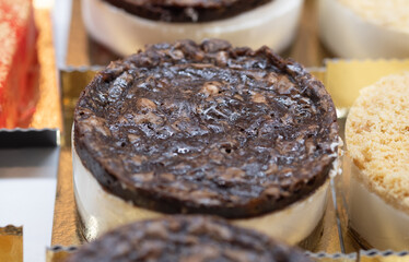 Small round cheesecakes chocolate decorated