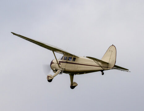 Vintage single engine monoplane at take off.