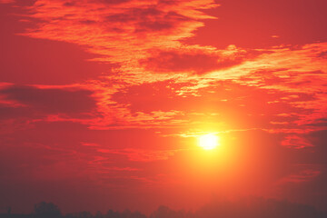 Red cloudy sky at blazing sunset. Sky texture. Abstract nature background
