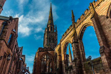 The spires and arches of the ruins of St Michaels Cathedral in Coventry, UK - obrazy, fototapety, plakaty