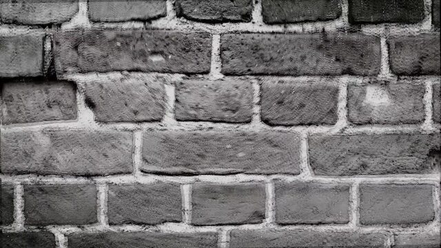 shaking black and white brick wall as texture background. Scaling wall of an old loft style building. Shaking background in motion and zoom.
