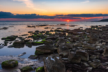 Colorful sunrise on the rocky coast