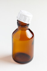 Empty medical bottle of dark brown glass