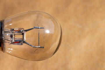 Old car envelope incandescent lamp. Close-up of filament